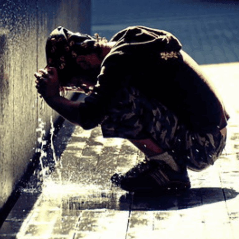 Person trying to cool down during heatwave
