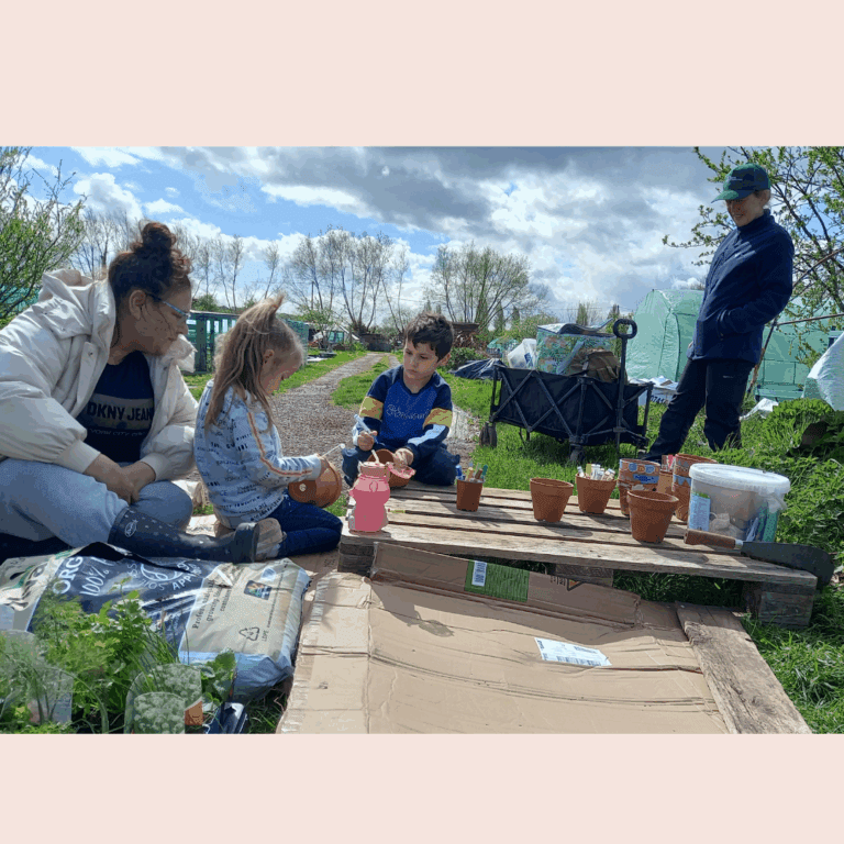Children planting plants in pots