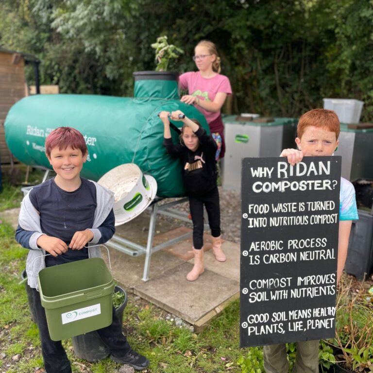 Group of children composting