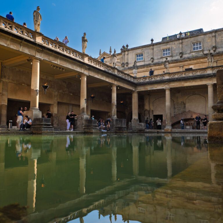 Old building with a body of water in front of it